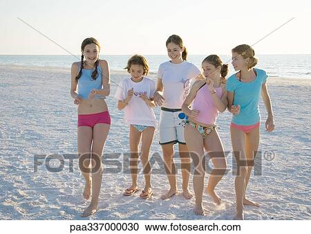 Group of girls dancing on beach View Large Photo Image Stock Image - Group of girls dancing on beach. Fotosearch