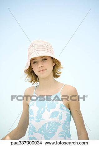 Picture - Preteen girl wearing sun hat, portrait. Fotosearch