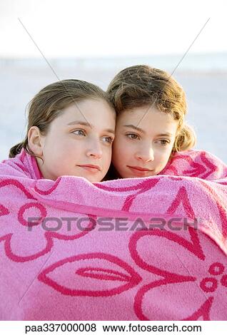 Stock Photo - Two girls wrapped in towel together. Fotosearch