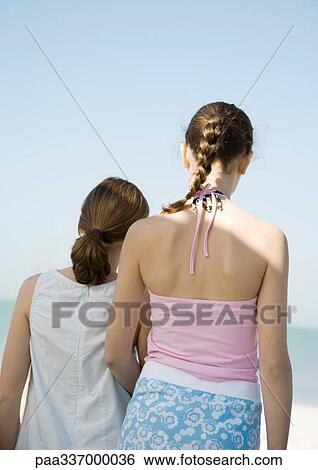 Stock Photograph - Two preteen girls, rear view. Fotosearch
