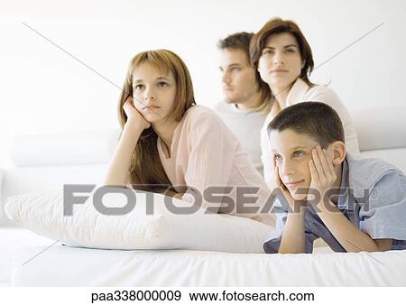Family watching tv View Large Photo Image Stock Photo - Family watching tv. Fotosearch