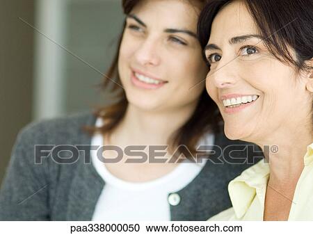 Young woman and mother, portrait View Large Photo Image Stock Image - Young woman and mother, portrait. Fotosearch