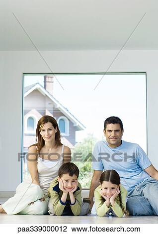 Family sitting on floor, portrait View Large Photo Image Stock Image - Family sitting on floor, portrait. Fotosearch