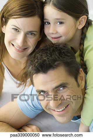 Stock Image - Family smiling, portrait. Fotosearch