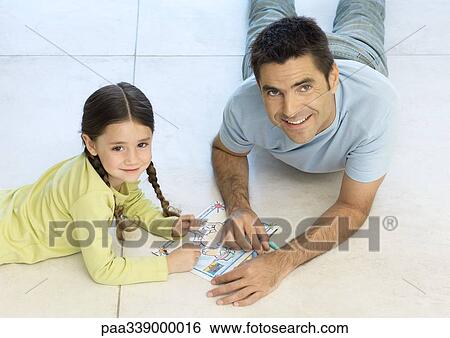 Father and daughter putting together puzzle together View Large Photo Image Stock Photograph - Father and daughter putting together puzzle together. Fotosearch