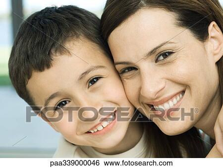 Mother and son smiling cheek to cheek View Large Photo Image Stock Photograph - Mother and son smiling cheek to cheek. Fotosearch