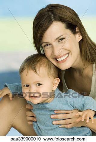 Woman with baby, portrait View Large Photo Image Stock Image - Woman with baby, portrait. Fotosearch