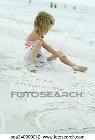 Girl sitting on beach View Large Photo Image Stock Image - Girl sitting on beach. Fotosearch