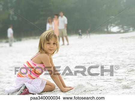 Little girl playing in sand View Large Photo Image Picture - Little girl playing in sand. Fotosearch