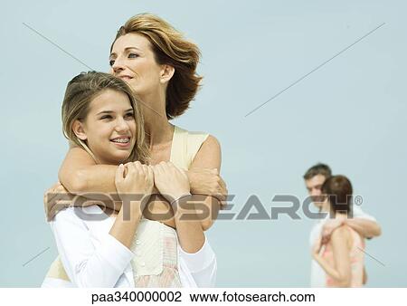 Stock Image - Mother with teenage daughter. Fotosearch