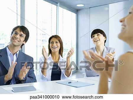 Business team clapping in meeting View Large Photo Image Stock Image - Business team clapping in meeting. Fotosearch