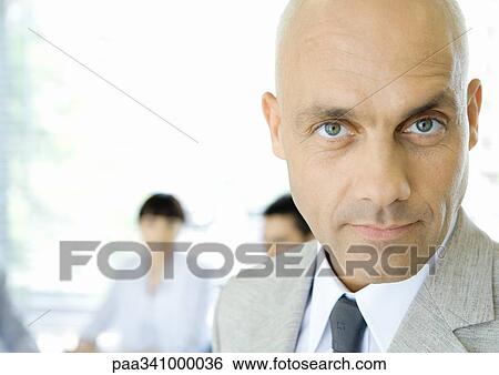 Businessman, looking at camera, portrait View Large Photo Image Stock Photograph - Businessman, looking at camera, portrait. Fotosearch