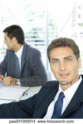 Picture - Businessman smiling, portrait. Fotosearch