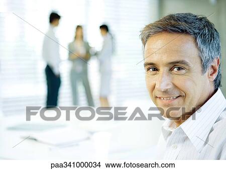 Businessman smiling, portrait View Large Photo Image Picture - Businessman smiling, portrait. Fotosearch