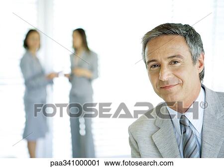 Businessman smiling, portrait View Large Photo Image Stock Image - Businessman smiling, portrait. Fotosearch