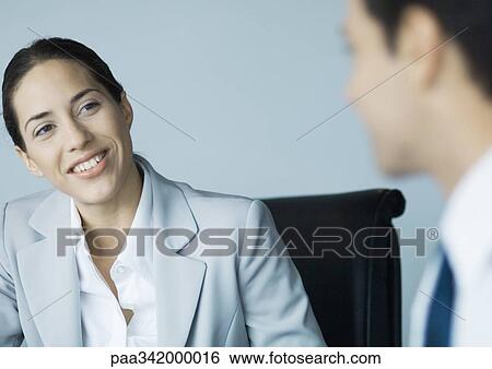 Business colleagues working together, smiling View Large Photo Image Stock Photograph - Business colleagues working together, smiling. Fotosearch