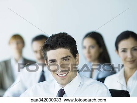 Business team, smiling View Large Photo Image Stock Image - Business team, smiling. Fotosearch