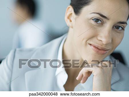 Stock Photo - Businesswoman smiling, portrait. Fotosearch