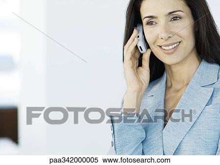 Businesswoman using cell phone View Large Photo Image Stock Photography - Businesswoman using cell phone. Fotosearch