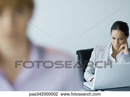 Businesswoman using laptop View Large Photo Image Stock Image - Businesswoman using laptop. Fotosearch