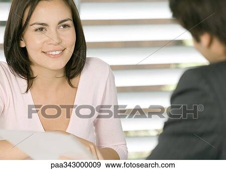 Woman having meeting with businessman, smiling View Large Photo Image Stock Photo - Woman having meeting with businessman, smiling. Fotosearch