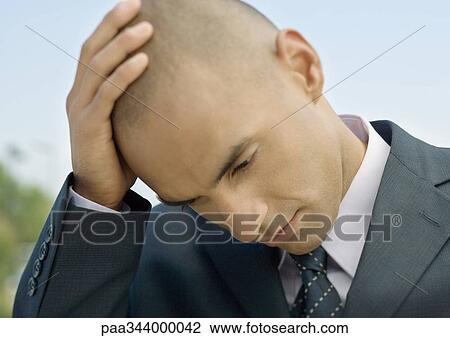 Businessman holding head View Large Photo Image Stock Image - Businessman holding head. Fotosearch