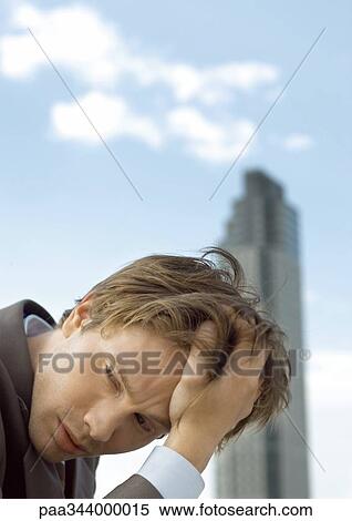 Businessman holding head View Large Photo Image Stock Photography - Businessman holding head. Fotosearch