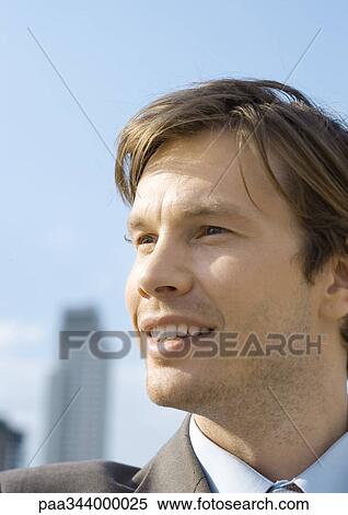 Young businessman smiling, portrait View Large Photo Image Stock Photography - Young businessman smiling, portrait. Fotosearch
