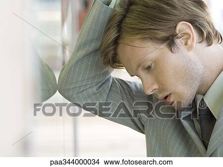 Young businessman with head down View Large Photo Image Picture - Young businessman with head down. Fotosearch