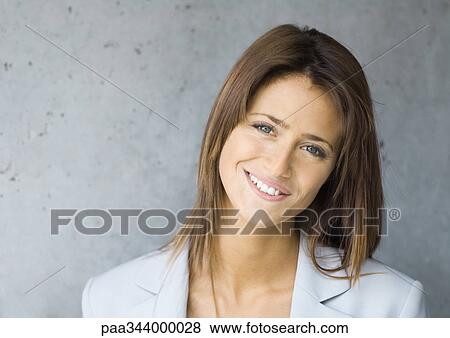 Young businesswoman smiling, portrait View Large Photo Image Stock Photo - Young businesswoman smiling, portrait. Fotosearch
