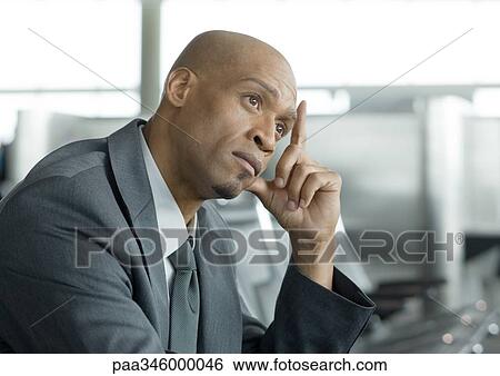 Businessman holding head and thinking View Large Photo Image Stock Photograph - Businessman holding head and thinking. Fotosearch
