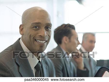 Businessman smiling at camera View Large Photo Image Stock Photography - Businessman smiling at camera. Fotosearch