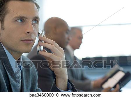 Businessman using cell phone View Large Photo Image Stock Image - Businessman using cell phone. Fotosearch