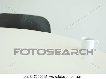 Coffee cup on edge of table View Large Photo Image Stock Photography - Coffee cup on edge of table. Fotosearch