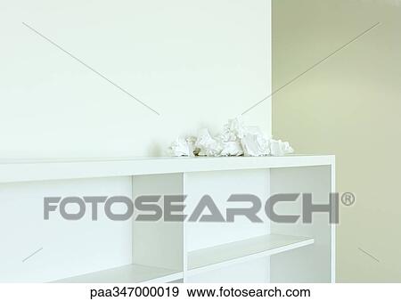Crumpled papers on top of empty bookcase View Large Photo Image Stock Photo - Crumpled papers on top of empty bookcase. Fotosearch