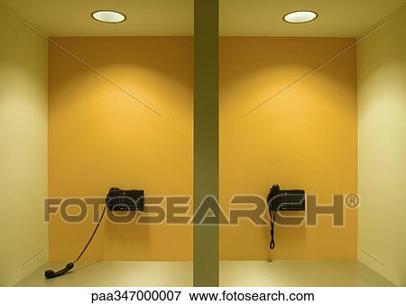 Two wall phones, one off the hook View Large Photo Image Stock Photo - Two wall phones, one off the hook. Fotosearch