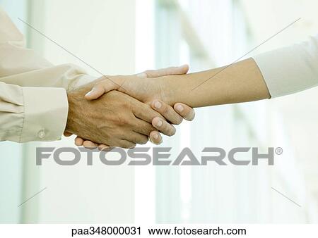 Man clasping woman's hand, close-up View Large Photo Image Stock Image - Man clasping woman's hand, close-up. Fotosearch