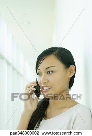 Woman using cell phone View Large Photo Image Stock Image - Woman using cell phone. Fotosearch