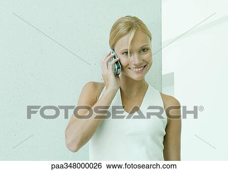 Woman using cell phone View Large Photo Image Stock Photograph - Woman using cell phone. Fotosearch