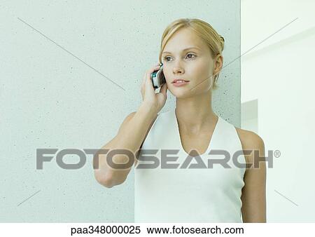Woman using cell phone View Large Photo Image Stock Photography - Woman using cell phone. Fotosearch
