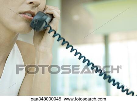 Woman using telephone, cropped View Large Photo Image Stock Photography - Woman using telephone, cropped. Fotosearch