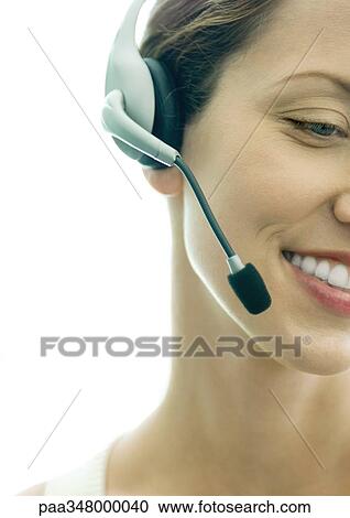 Woman wearing headset, cropped View Large Photo Image Stock Image - Woman wearing headset, cropped. Fotosearch