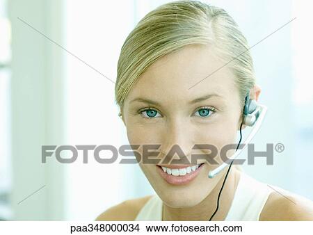 Woman wearing headset View Large Photo Image Picture - Woman wearing headset. Fotosearch