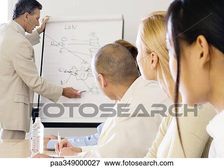 Stock Photo - Businessman giving presentation. Fotosearch