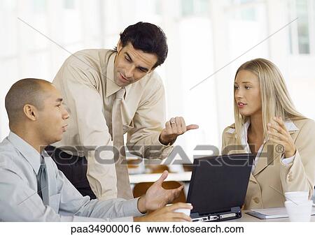 Three young exectives having discussion View Large Photo Image Stock Photograph - Three young exectives having discussion. Fotosearch