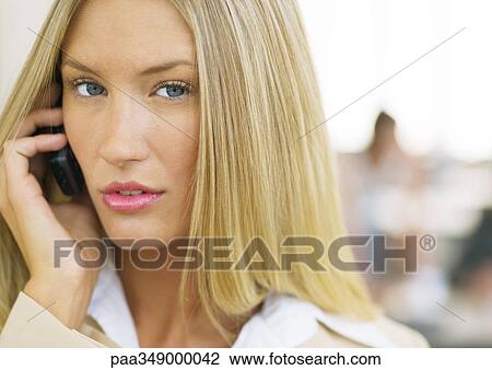 Young businesswoman using cell phone View Large Photo Image Stock Image - Young businesswoman using cell phone. Fotosearch