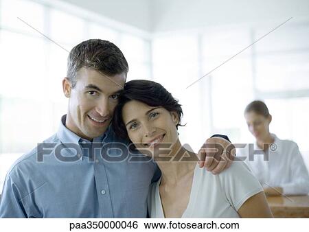 Couple standing in front of reception desk View Large Photo Image Stock Photograph - Couple standing in front of reception desk. Fotosearch