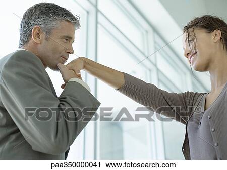Man kissing woman's hand View Large Photo Image Stock Image - Man kissing woman's hand. Fotosearch
