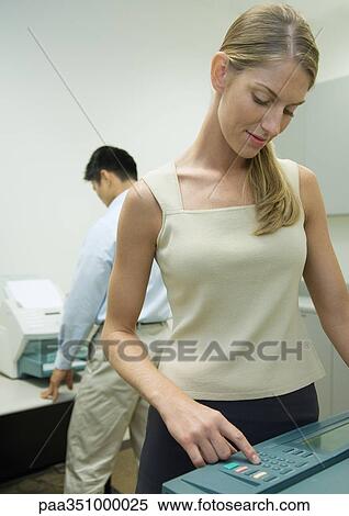 Office workers making copies and sending faxes View Large Photo Image Stock Photography - Office workers making copies and sending faxes. Fotosearch