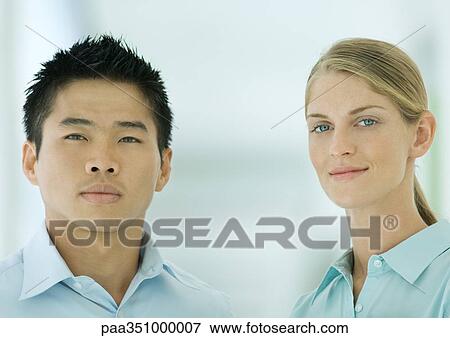 Two office workers, portrait View Large Photo Image Stock Photo - Two office workers, portrait. Fotosearch